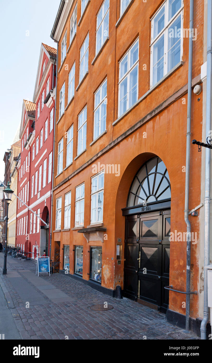 The Danish writer Hans Christian Andersen lived at 3 addresses in Nyhavn, Copenhagen,  from 1834 to 1875. Latest in the orange house. See description. Stock Photo