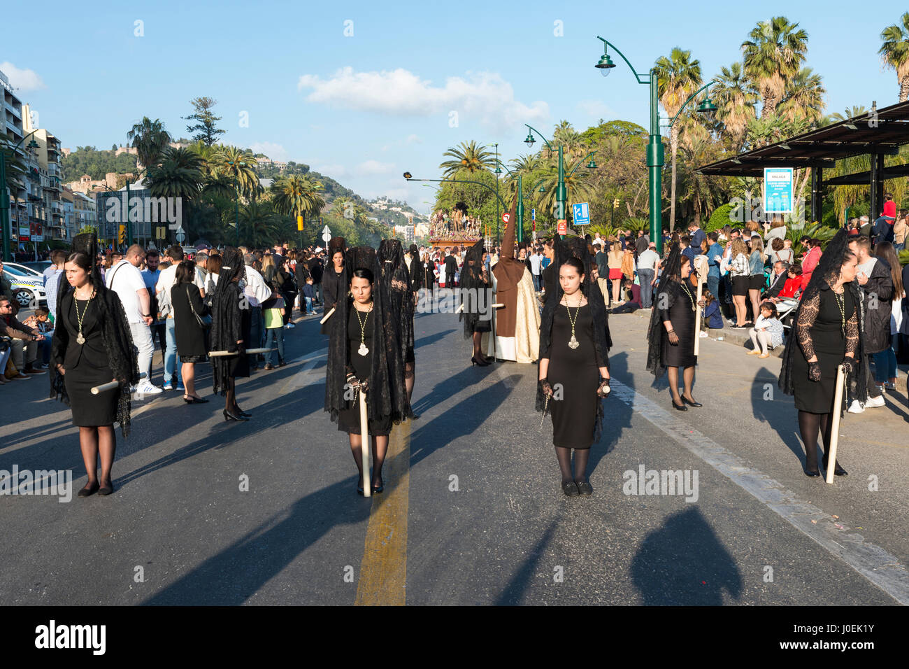 MALAGA,SPAIN-APRIL 09 2017:Unidentified woman walking in the catholic processions called Semena Santa in Malaga on April 09 2017, this processions are Stock Photo