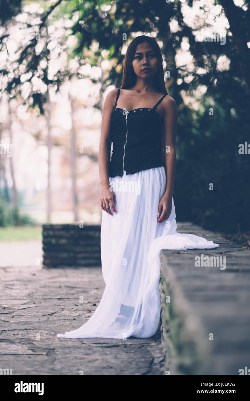 Beautiful girl in long white dress Stock Photo