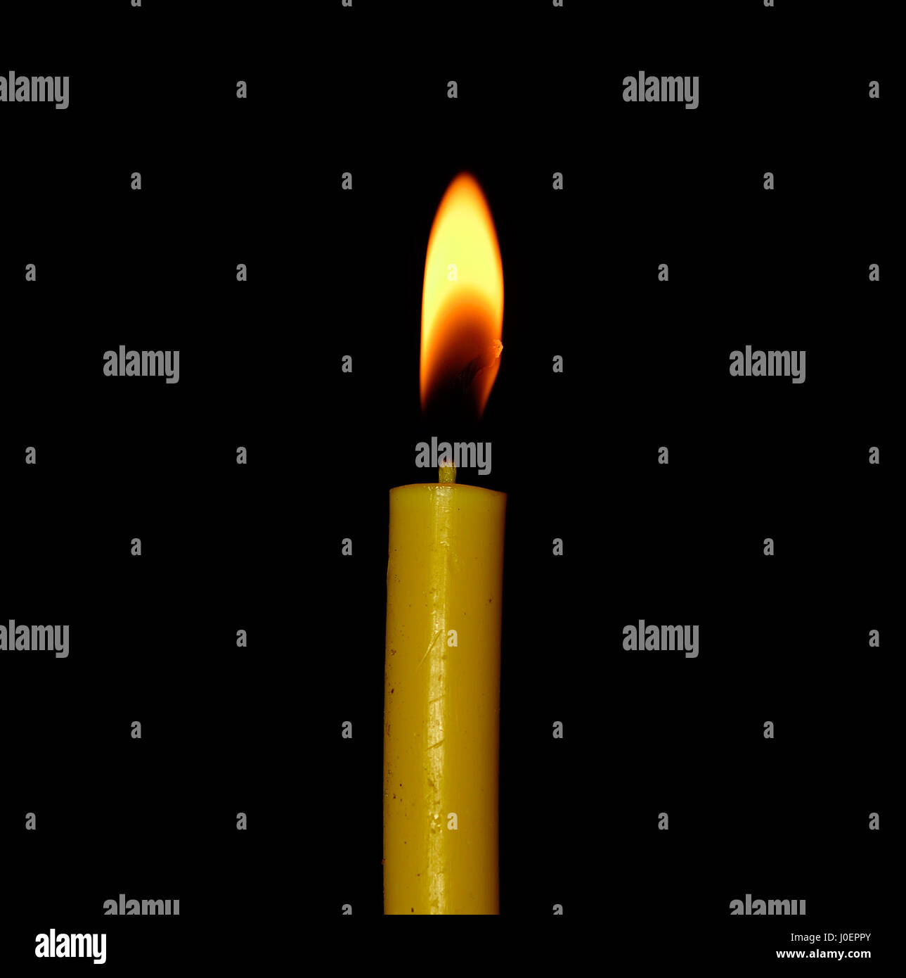 Candle flame closeup isolated on black background Stock Photo - Alamy