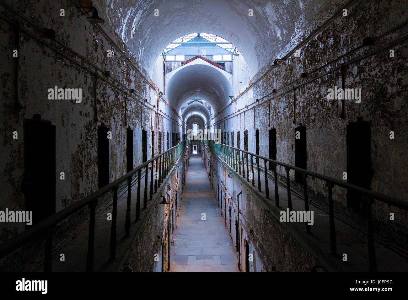 An abandoned cell block at the Eastern State Penitentiary in Philadelphia, Pennsylvania. Stock Photo