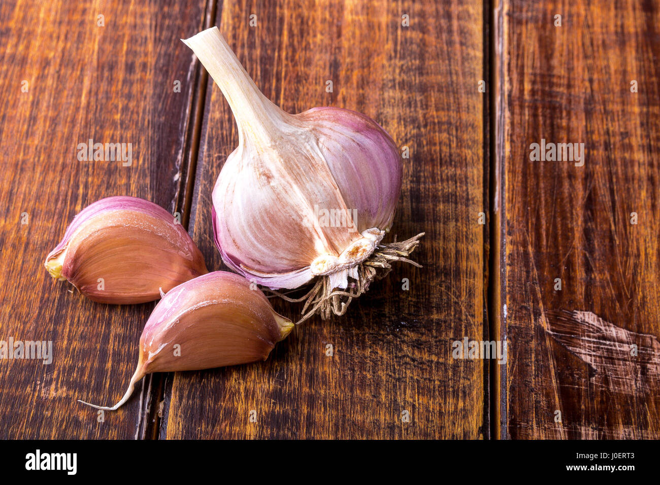 Part of garlic on wooden background. Rustic. Copy space. Top view Stock ...