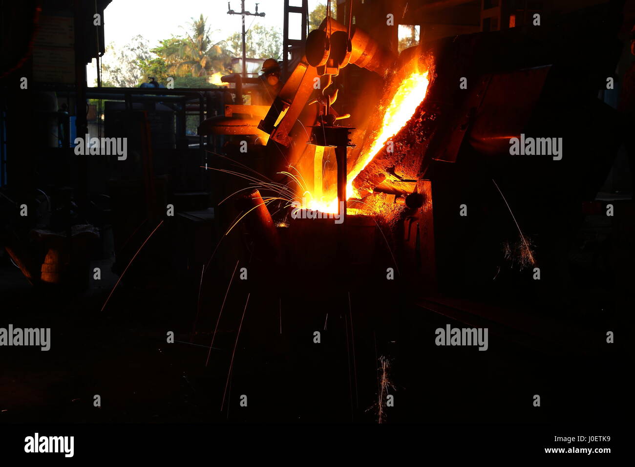 Molten metal pouring in foundry Stock Photo