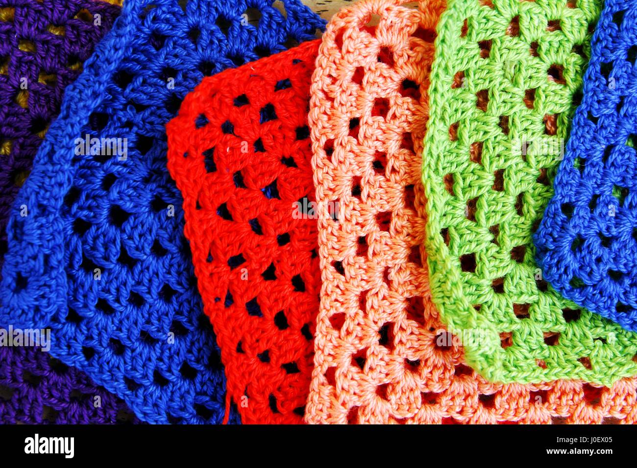 Photo of colorful crochet hooks and granny squares Stock Photo Alamy