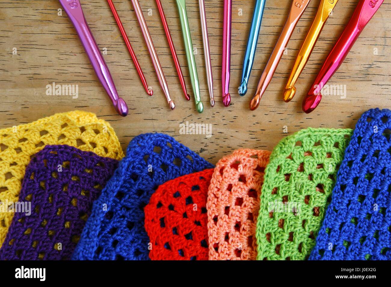 Photo of colorful crochet hooks and granny squares Stock Photo Alamy