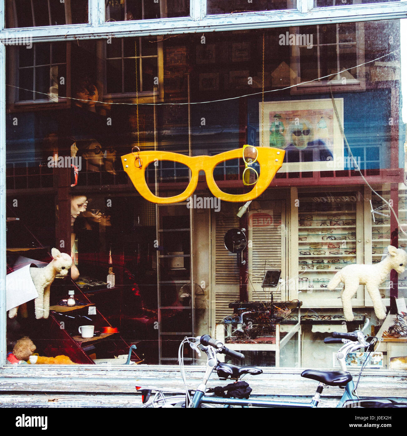 The window of a shop selling old glasses in Amsterdam, Netherlands Stock Photo