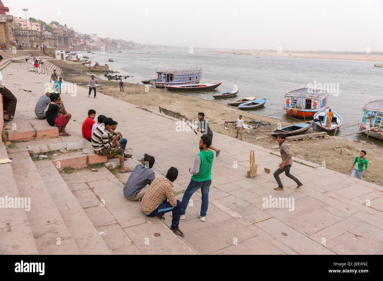 Children playing cricket on ghats, varanasi, uttar pradesh, india, asia Stock Photo