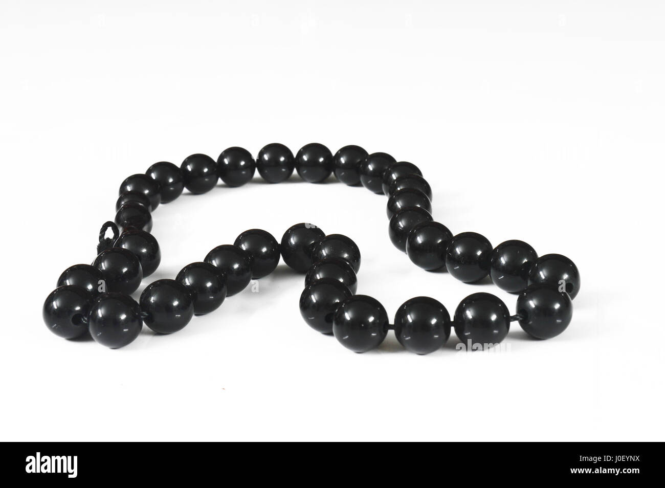 black beads isolated on white Stock Photo Alamy