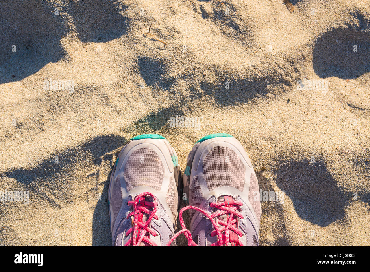 Top view of shoes on tropical sand beach, selfie, travel concept. Stock Photo
