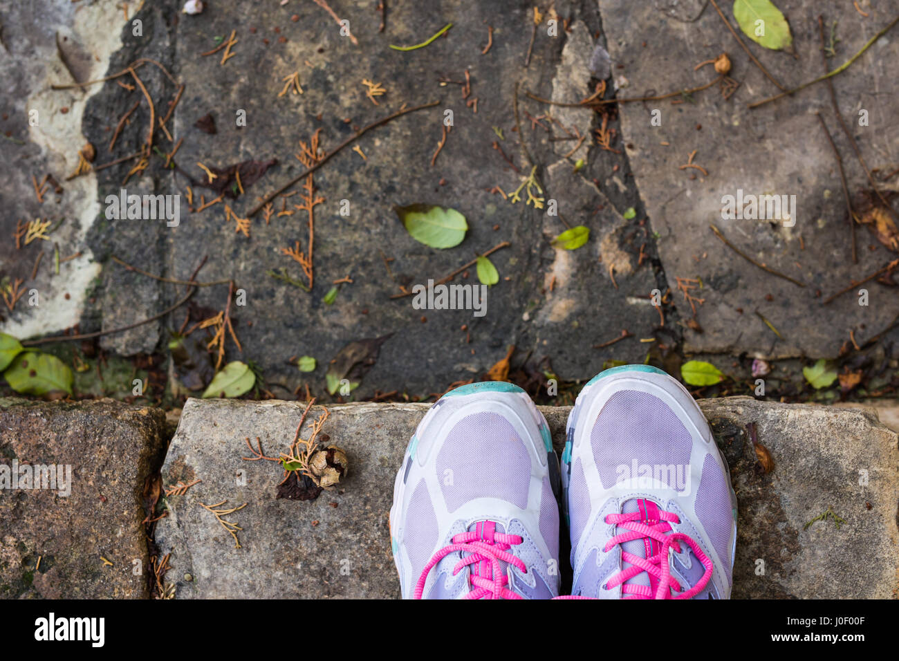 Sneakers shoes walking on concrete look top view , Canvas shoes on