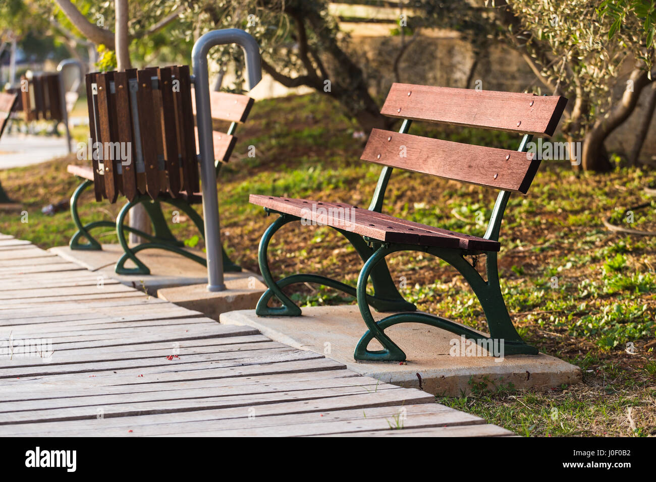 Wooden benches in the city park Stock Photo - Alamy