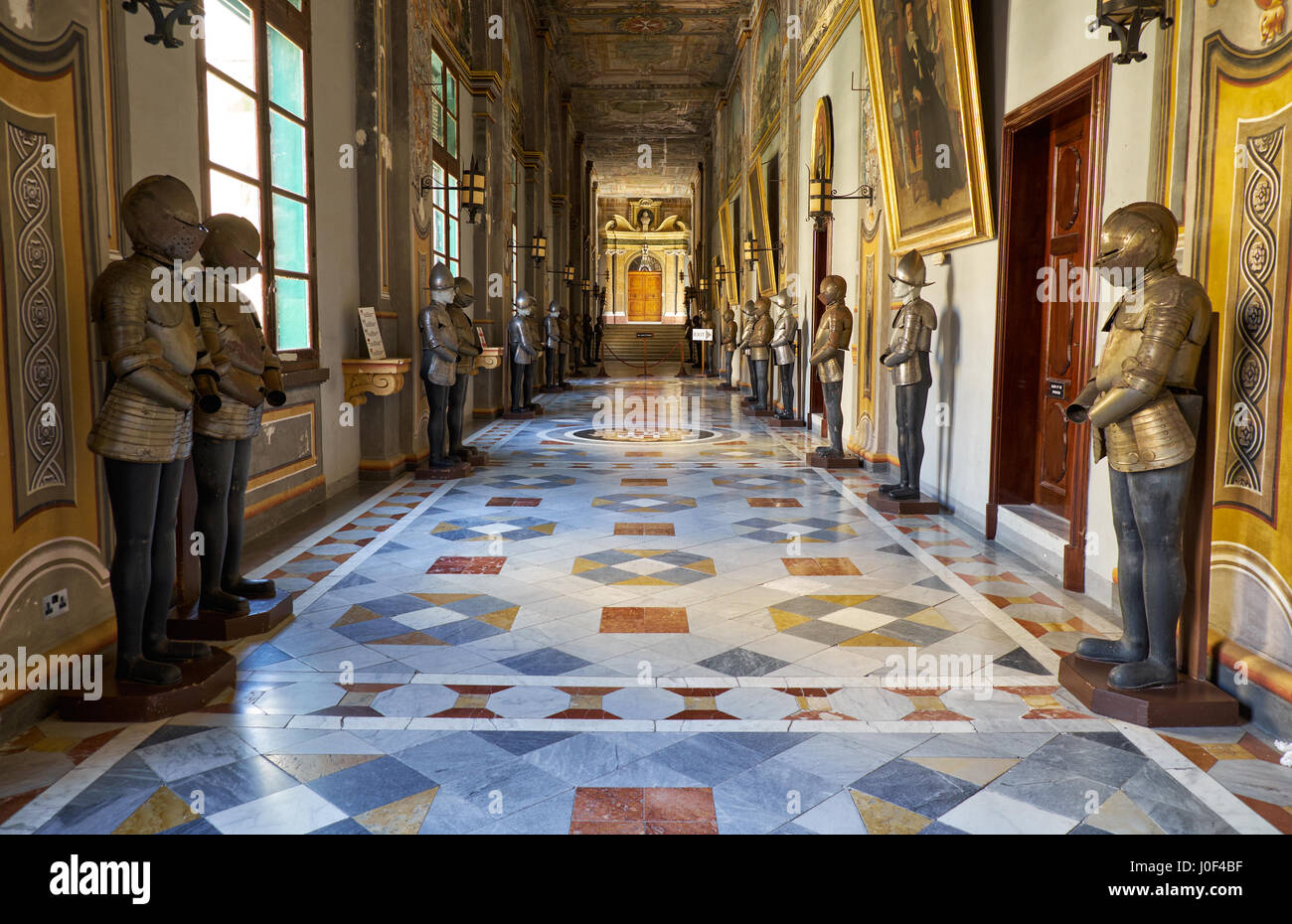 VALLETTA, MALTA - JULY 31, 2015: The view of the long Armoury Corridor on the main floor of the Grandmaster's Palace with the suits of armour of the M Stock Photo