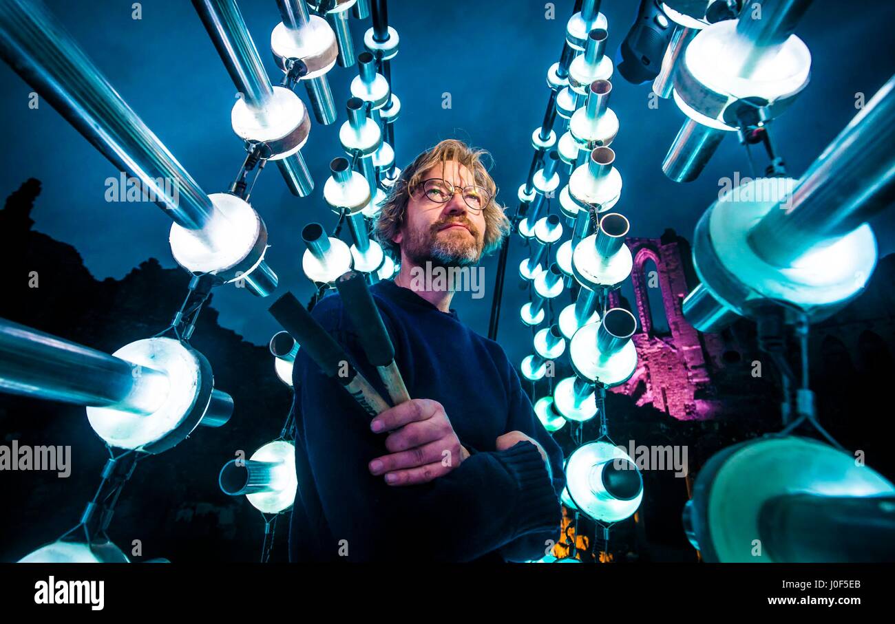 Artist Michael Davis with his interactive musical installation 'Illumaphonium', on show during the Brocken Spectre light and sound event at Rievaulx Abbey on the North York Moors. Stock Photo