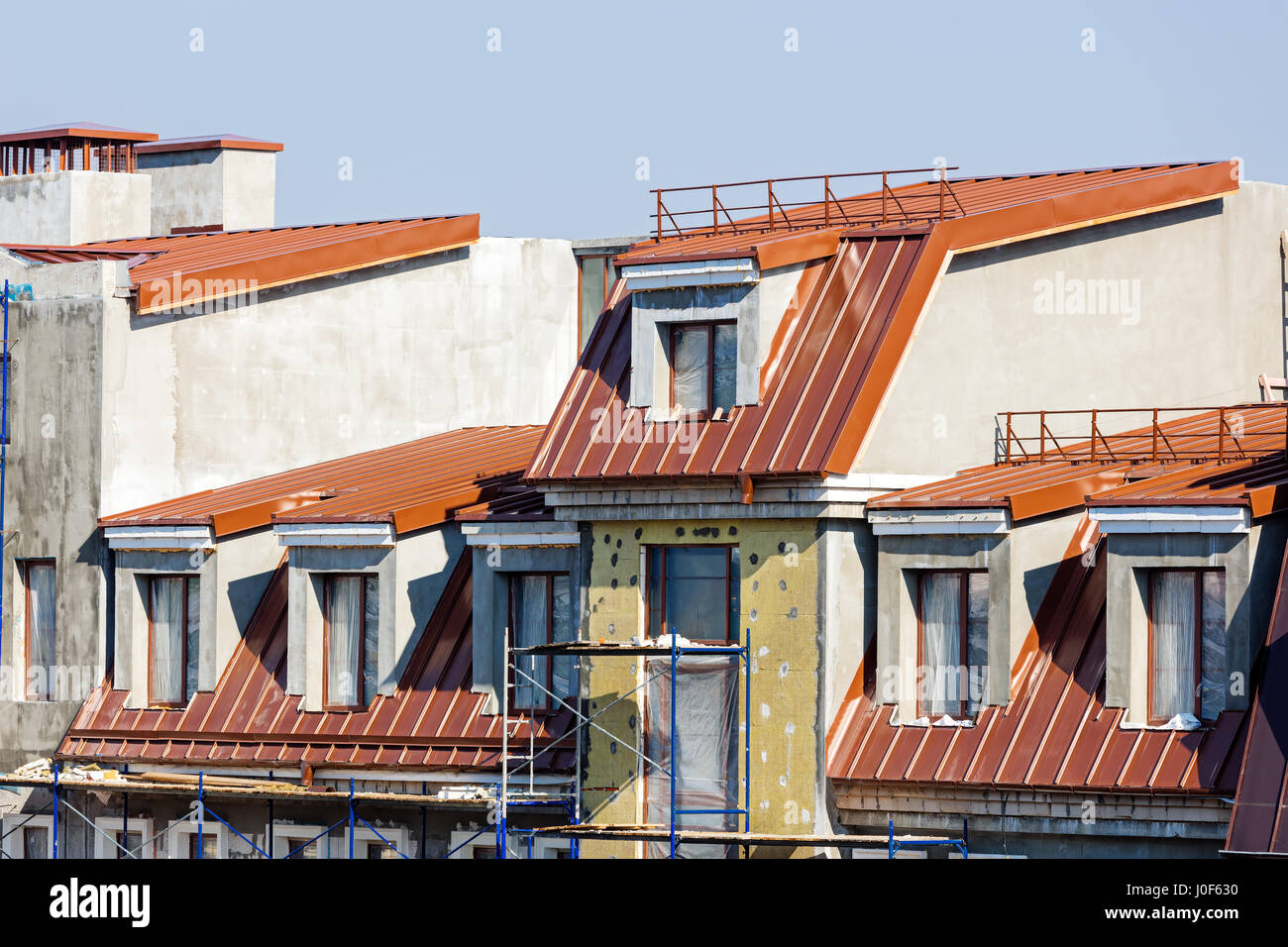 thermal insulation of apartment building facade. construction site with ...