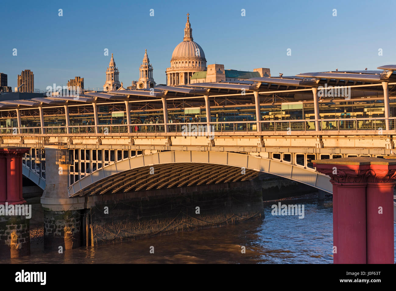 Blackfriars Bridge railway station and St Paul's Cathedral dome  London UK Stock Photo