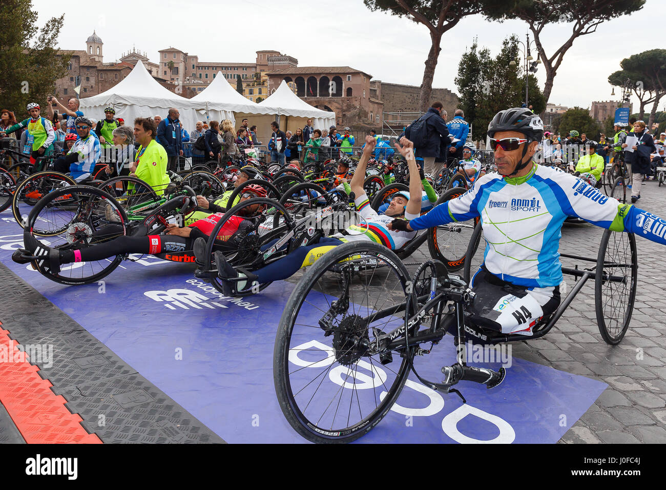 Rome, Italy - April 2nd, 2017: Athletes with hand bikes are prepared before departure at the 23rd Marathon of Rome, in Via dei Fori Imperiali. Stock Photo