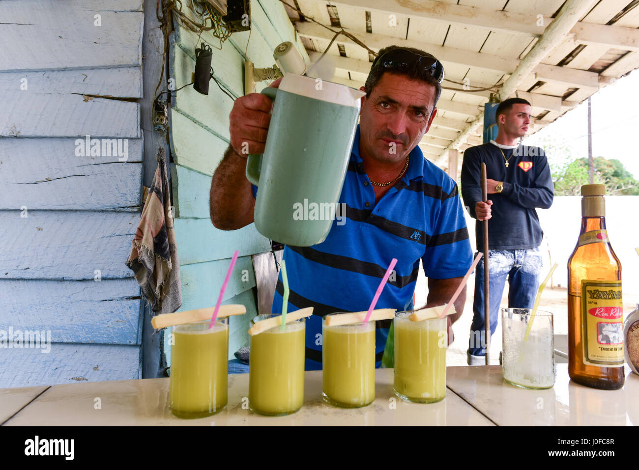 Manaca Iznaga, Cuba - Jan 12, 2017: Cuban man selling sugar cane juice (guarapo) in Manaca Iznaga, Valle de los Ingenios, Trinidad, Cuba. Stock Photo