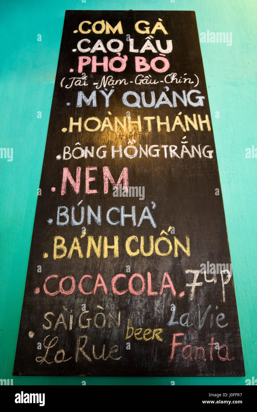 Vertical view of a chalkboard menu at a traditional Vietnamese restaurant, Vietnam. Stock Photo