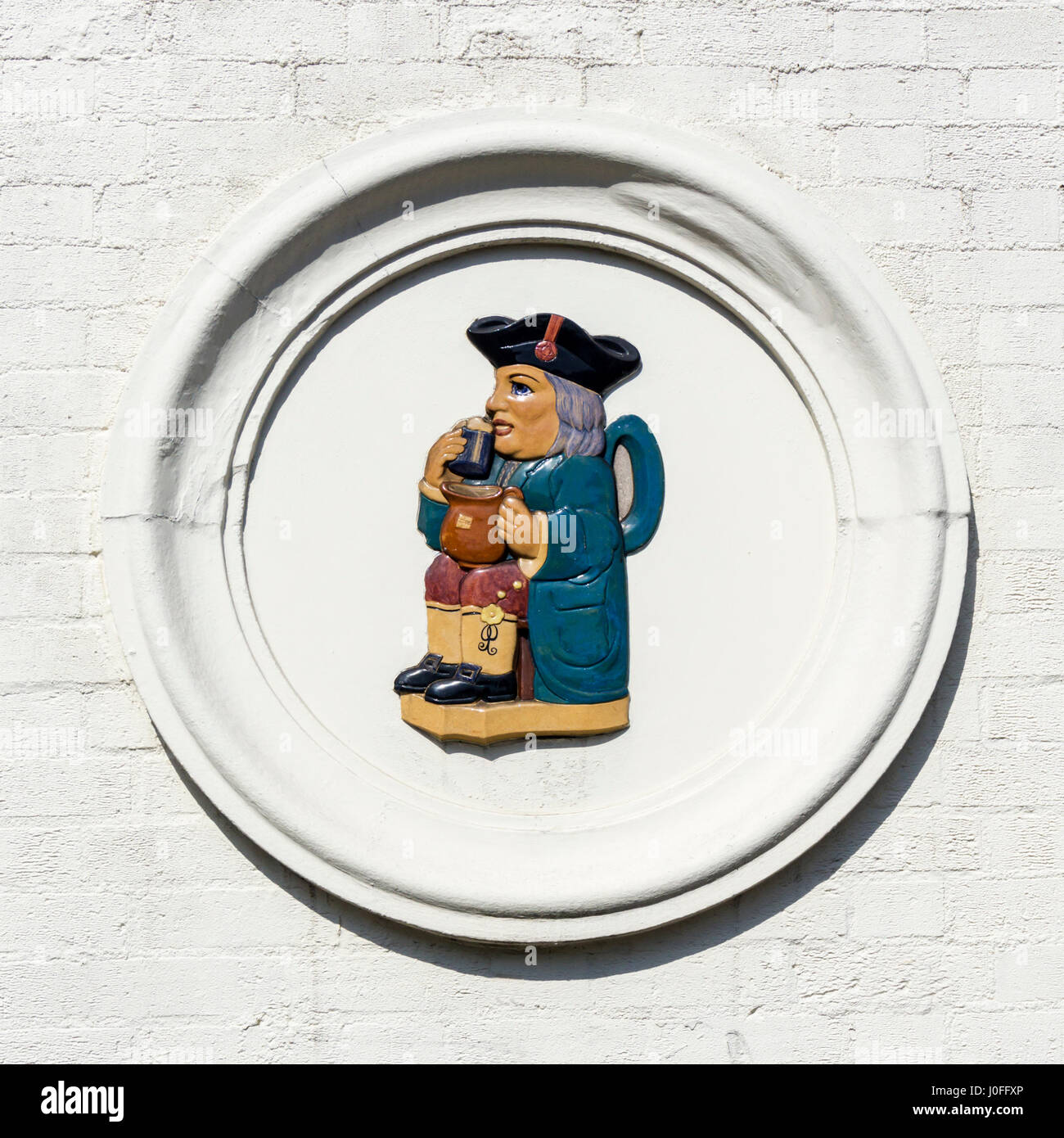 Ceramic Toby Jug sign on the side of a Public House. Stock Photo