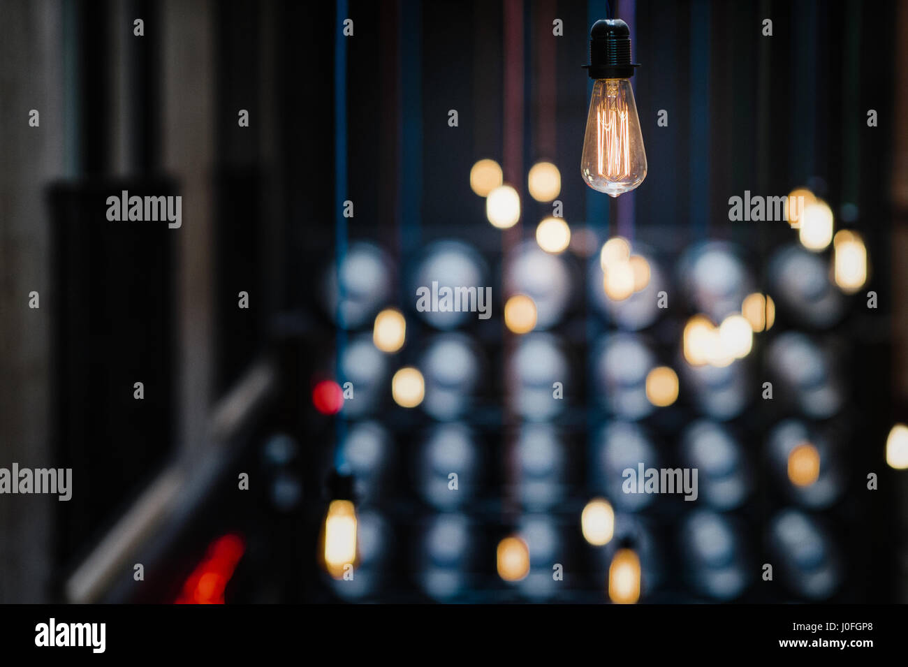 Single Retro Light Bulb Hanging From The Ceiling Stock Photo