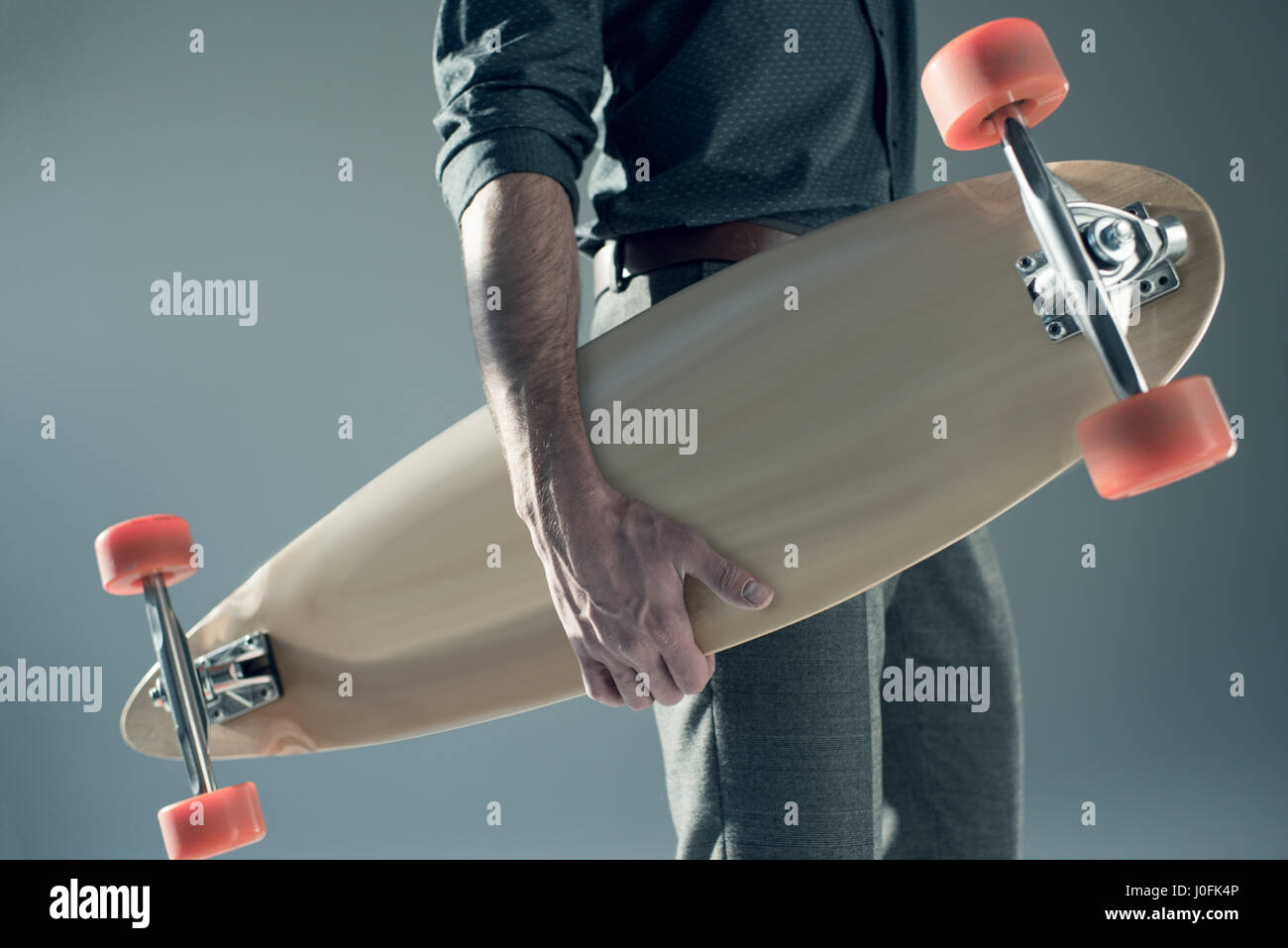 Hand holding skateboard hi-res stock photography and images - Alamy