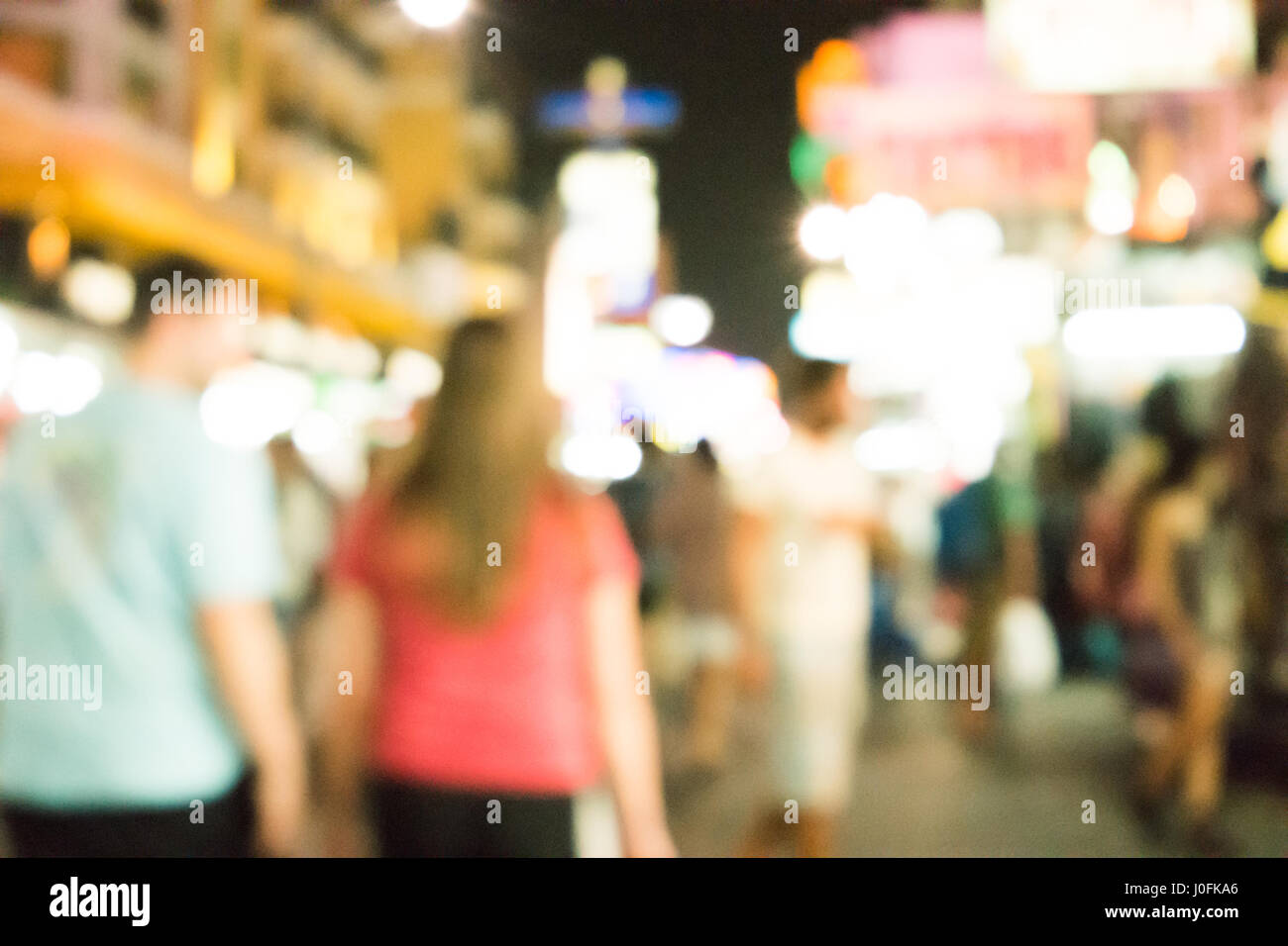 Blurred image of busy night life in the city Stock Photo - Alamy