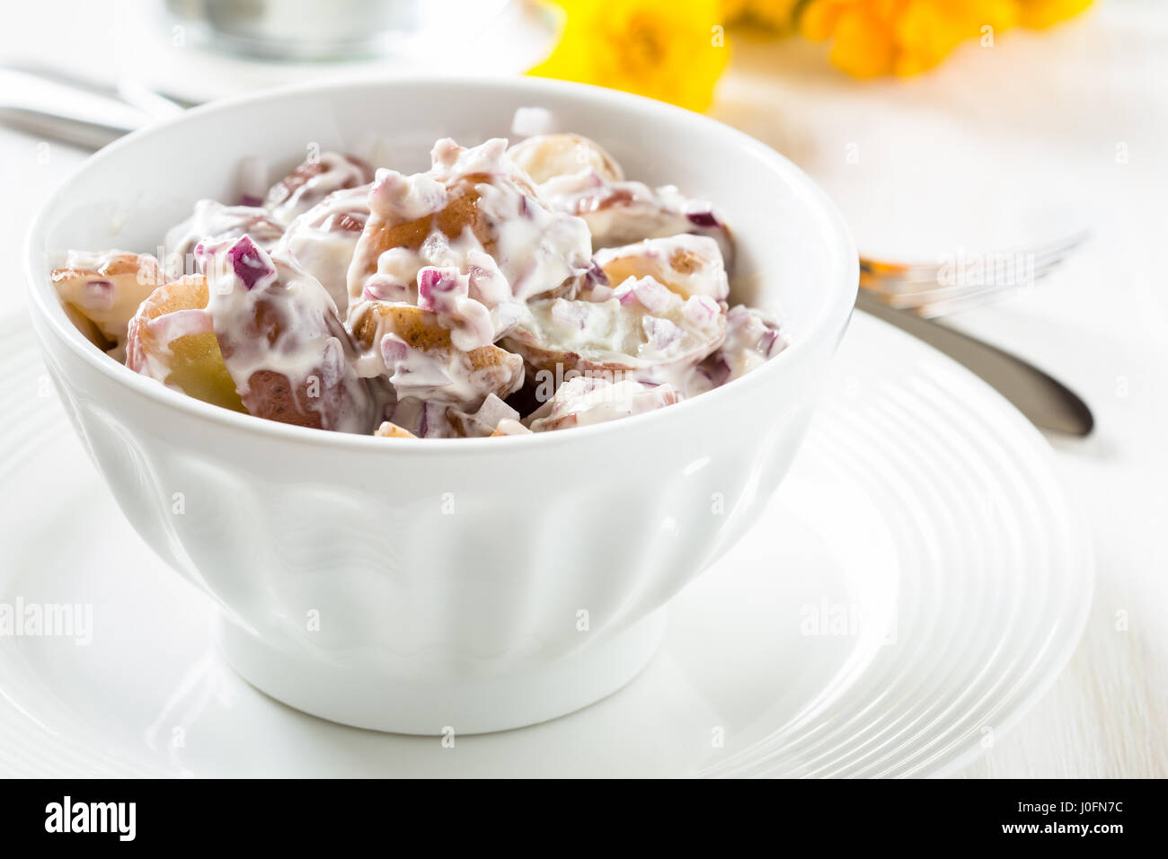 Potato salad made with boiled baby potatoes, mayonnaise, mustard and