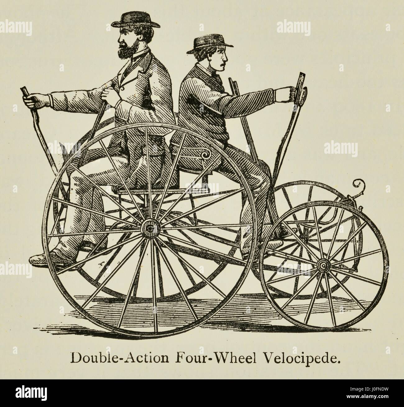 Two men riding a double-action four wheel velocipede Stock Photo