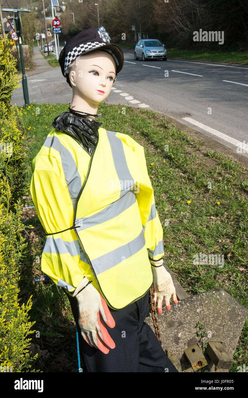 Fake, female,woman,police,officer,doll,mannequin,in,village,of,Tre Taliesin,to,encourage,motorists,drivers,to,slow,down,onA487,road,Ceredigion,Wales, Stock Photo