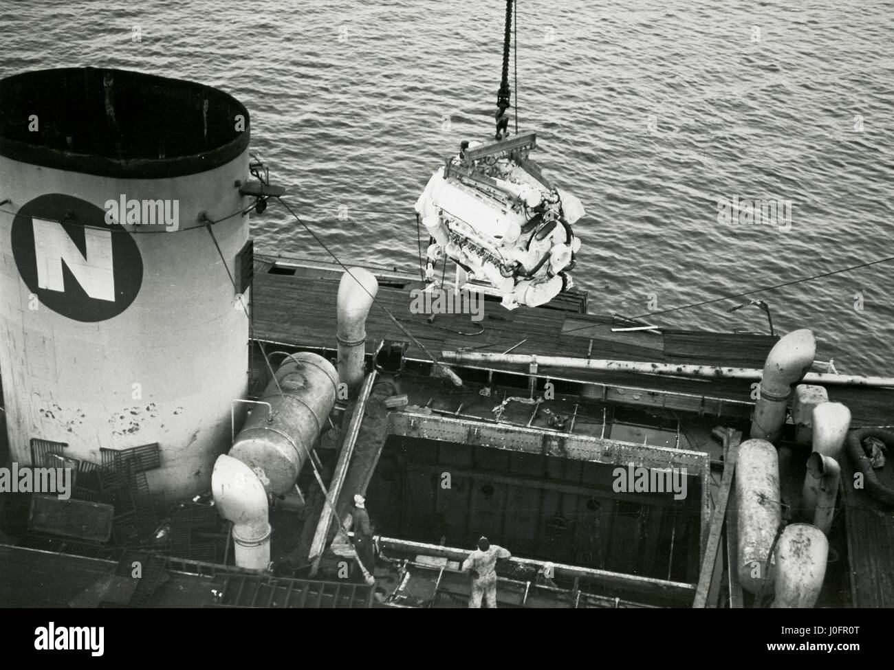 Deltic Marine Compound engine being lowered into a ship Stock Photo