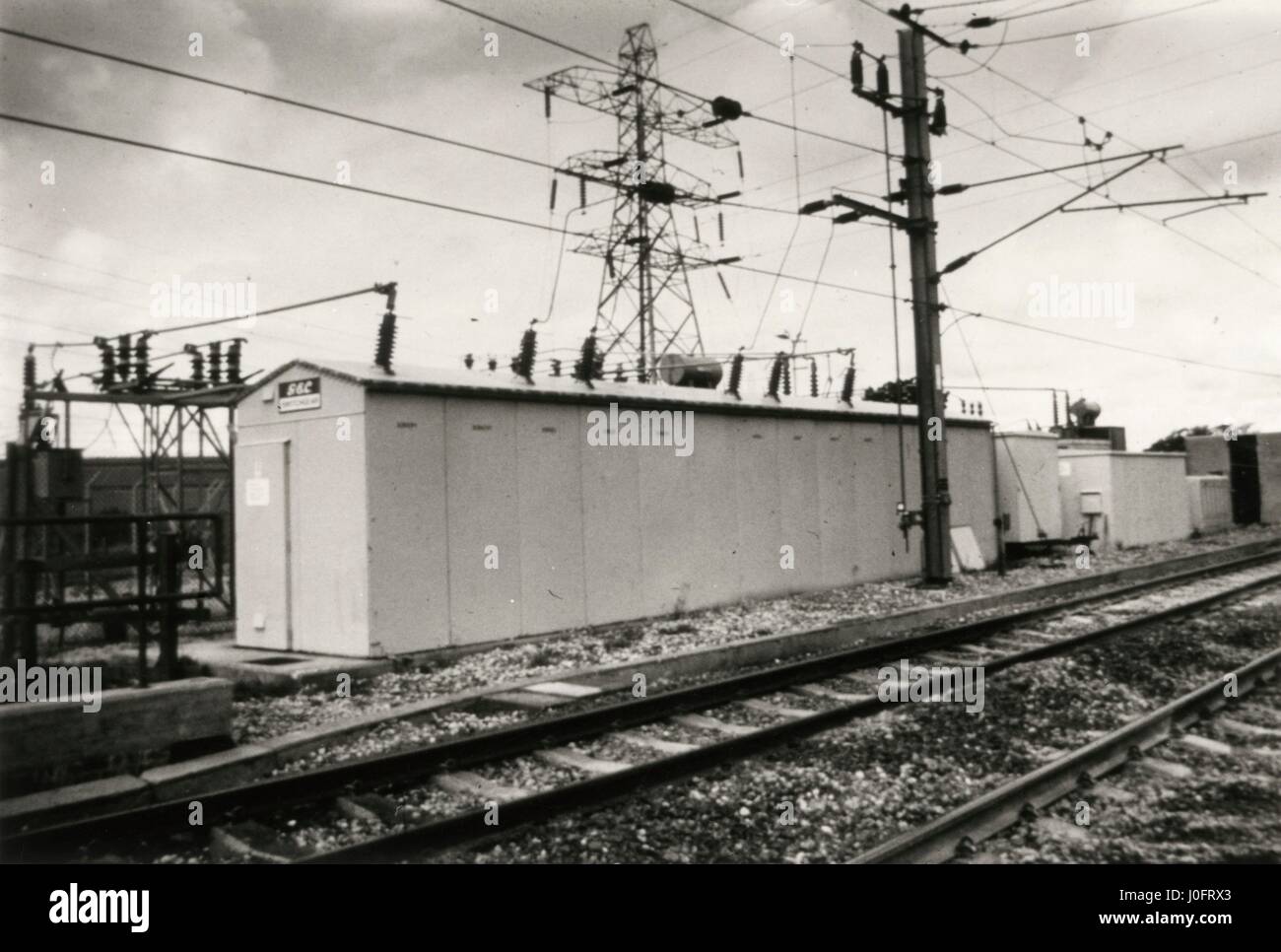 25kV feeder station with electricity overheads and tracks Stock Photo