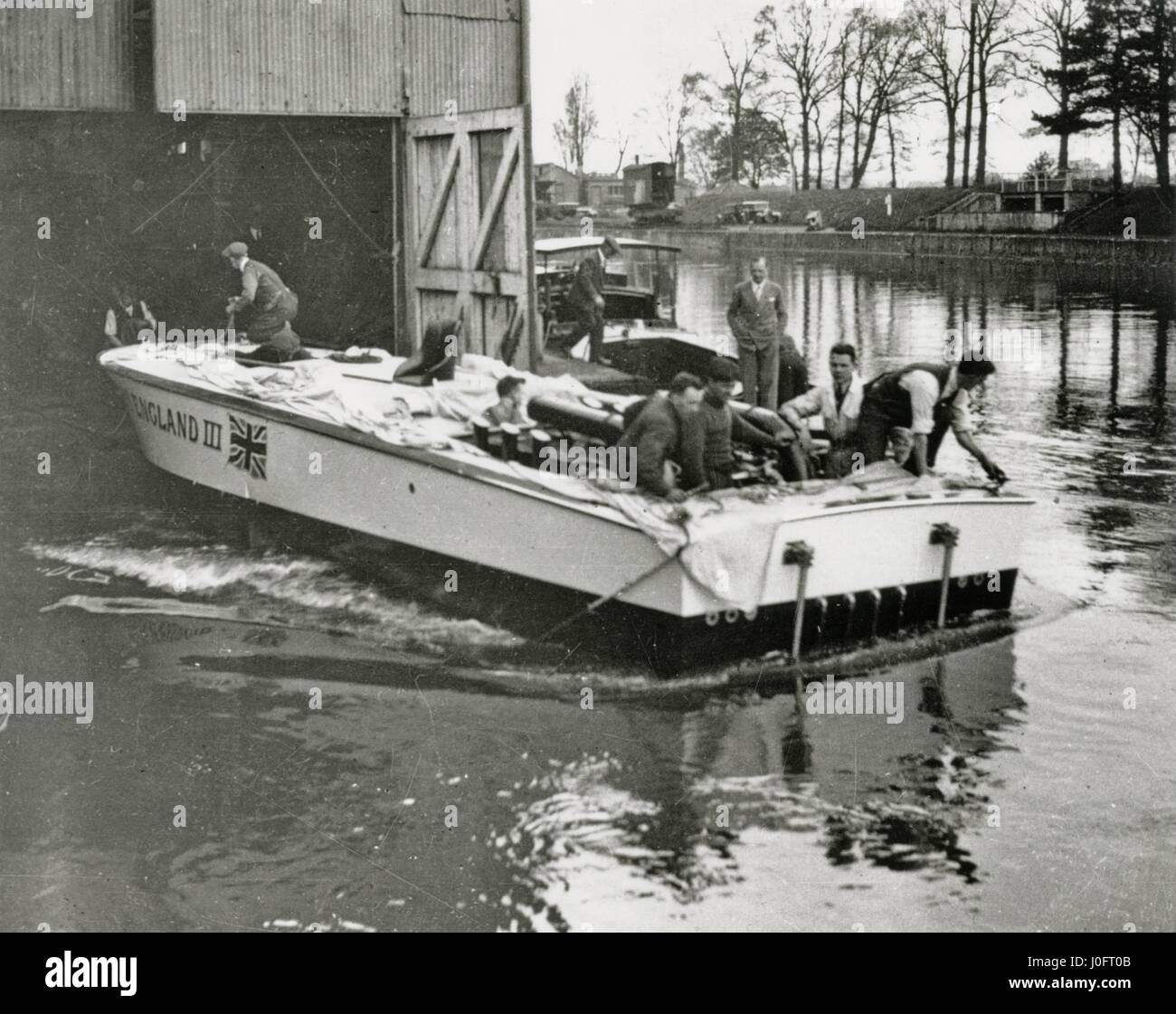 Entering the water from a boatshed, Miss England III, a speedboat built by Thornycroft Stock Photo