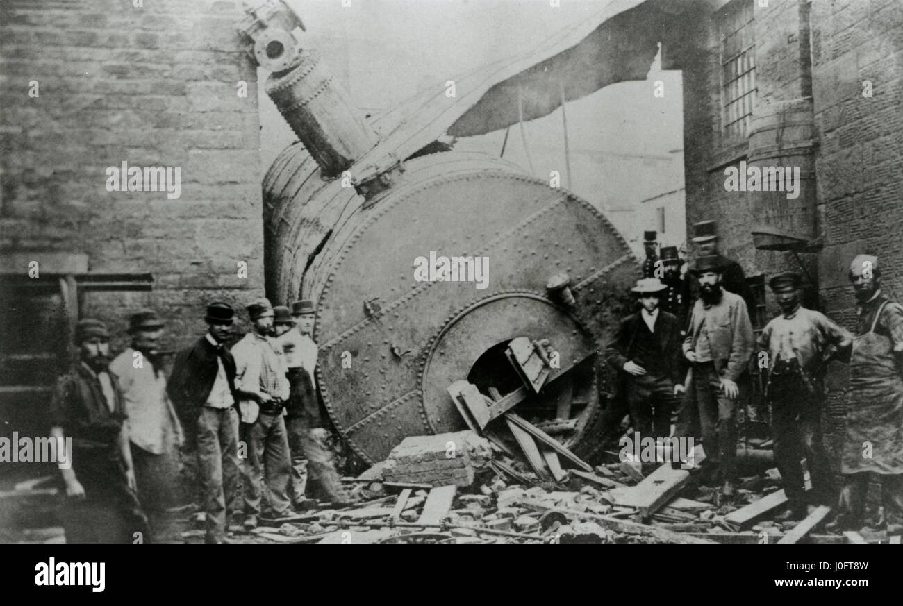 Men stand on either side of a collapsed boiler, taken from a report by Robert Longridge, July 1967 Stock Photo