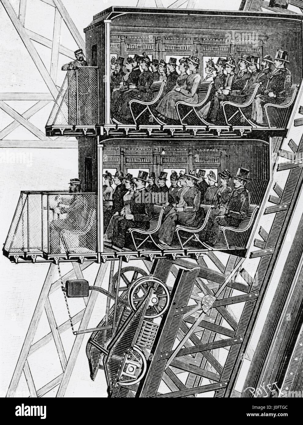 Eiffel Tower, lift with people in rows seated in a car Stock Photo