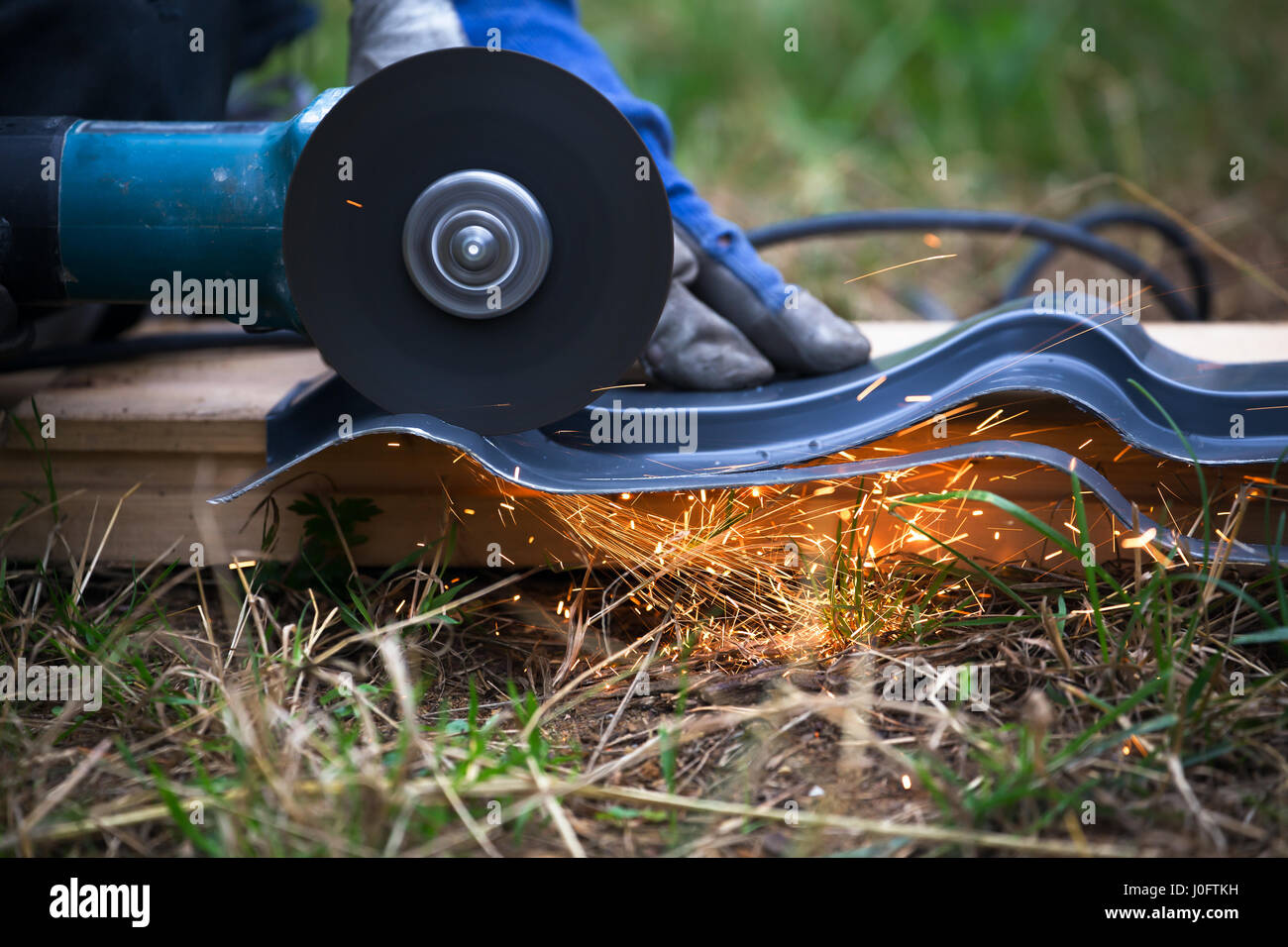 sharpening and cutting of iron by abrasive disk machine Stock Photo - Alamy