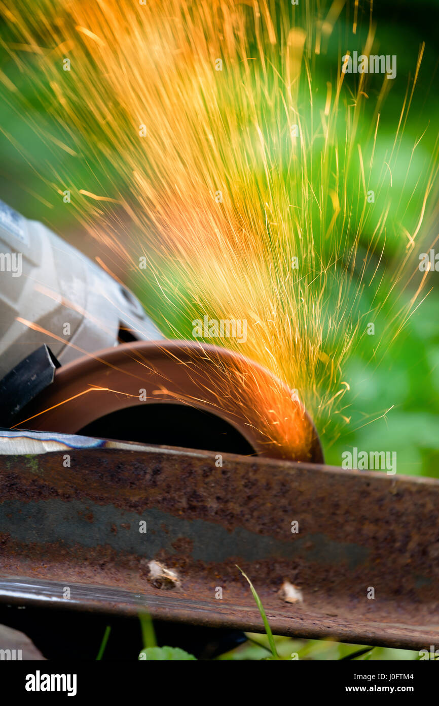 sharpening and cutting of iron by abrasive disk machine Stock Photo - Alamy