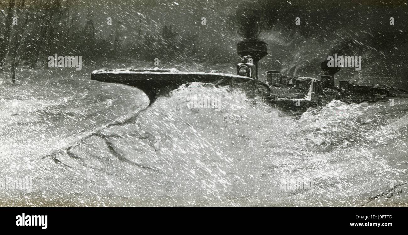 Train ploughing through snow storm Stock Photo