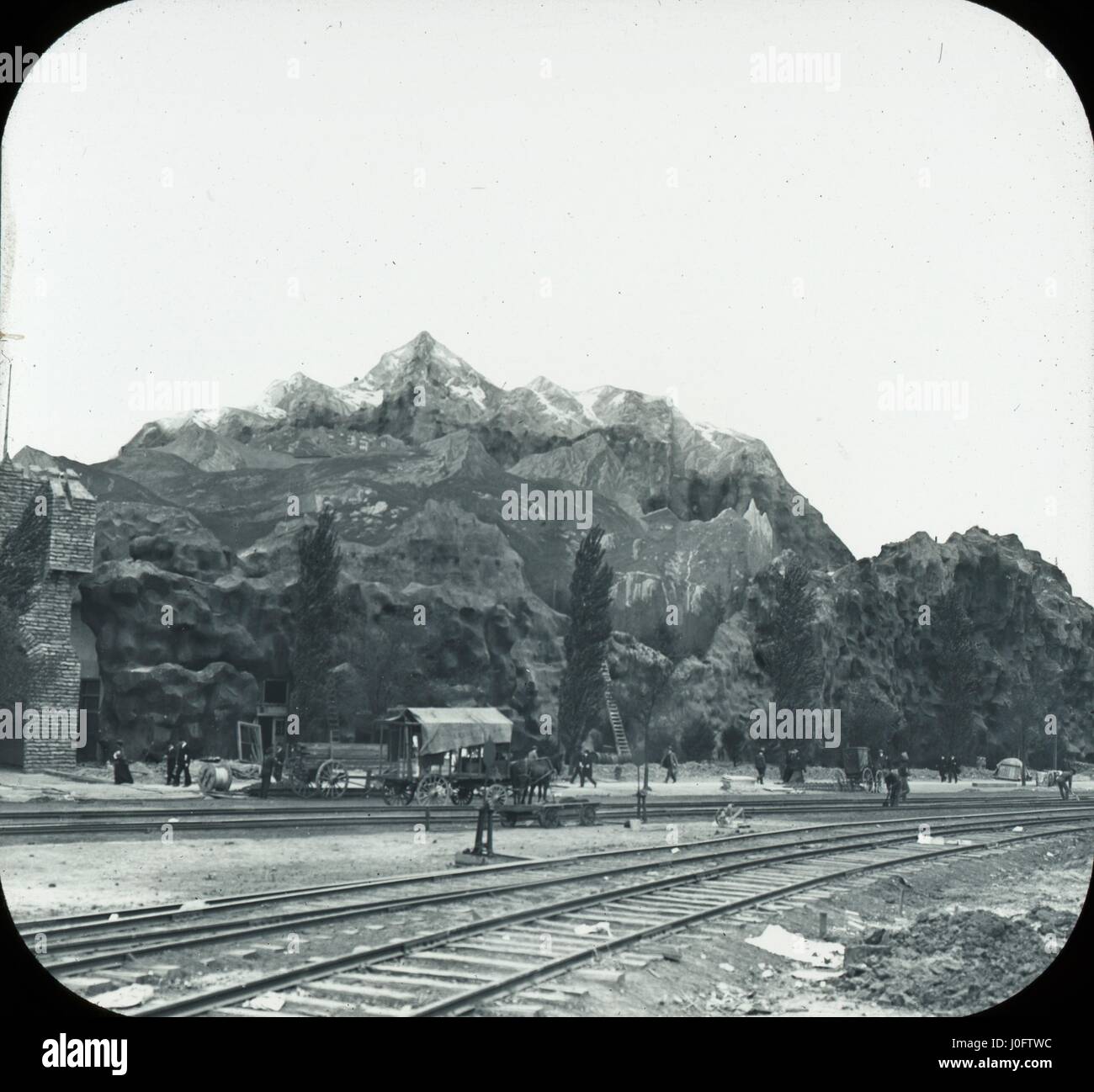 View of railway with mountains in background Stock Photo