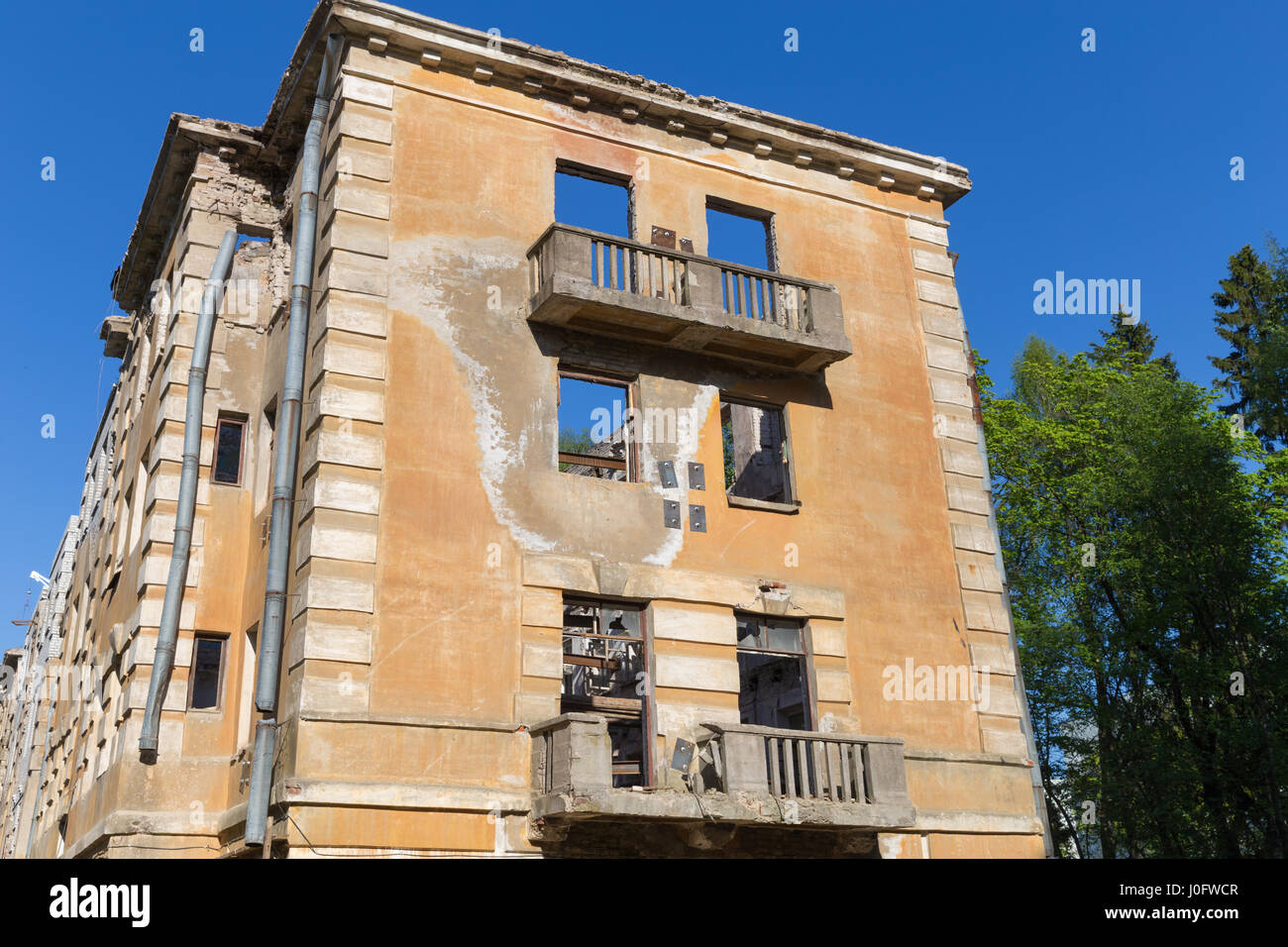 Abandoned building - broken tenement apartment house in daylight Stock ...