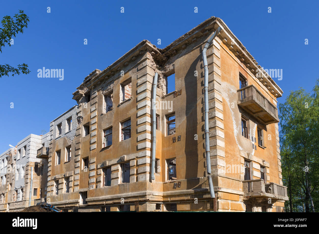 Abandoned building - broken tenement apartment house in daylight Stock ...