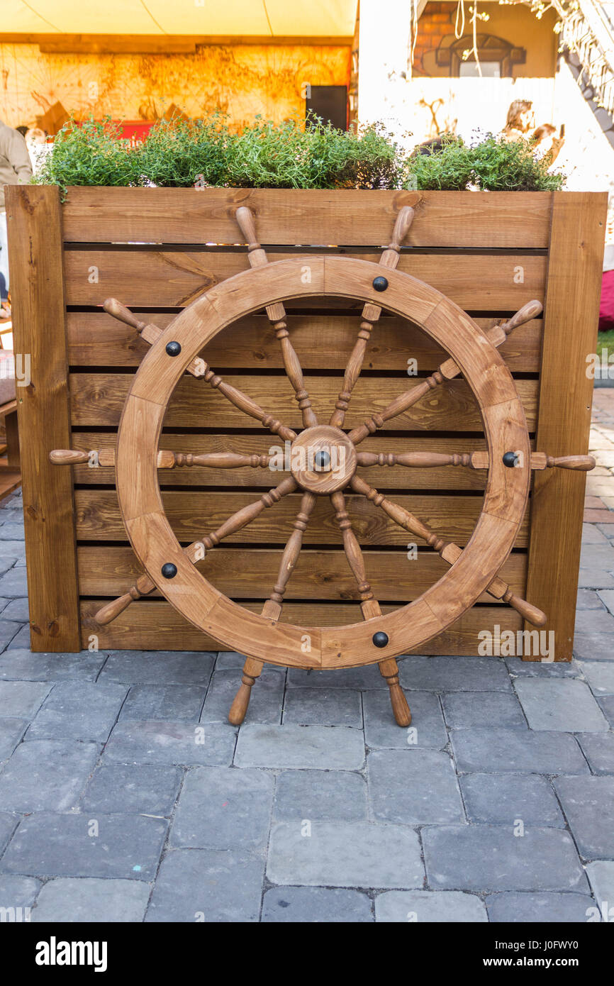 Steering the boat. Steering wheel captain Stock Photo Alamy