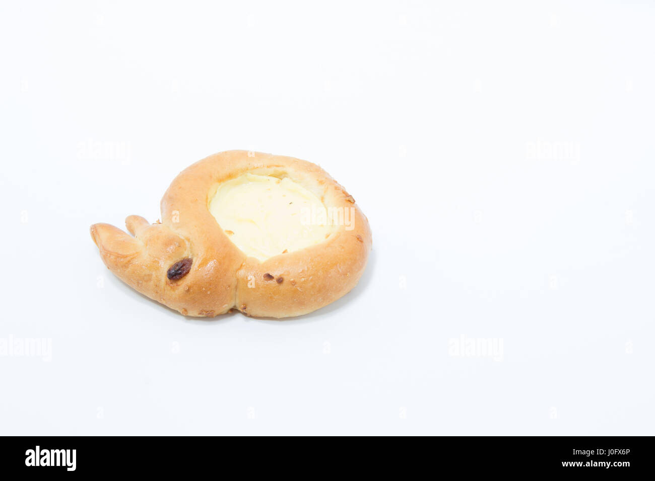 Easter bunny portuguese pastel egg tart pastry round and yellow isolated in white background Stock Photo