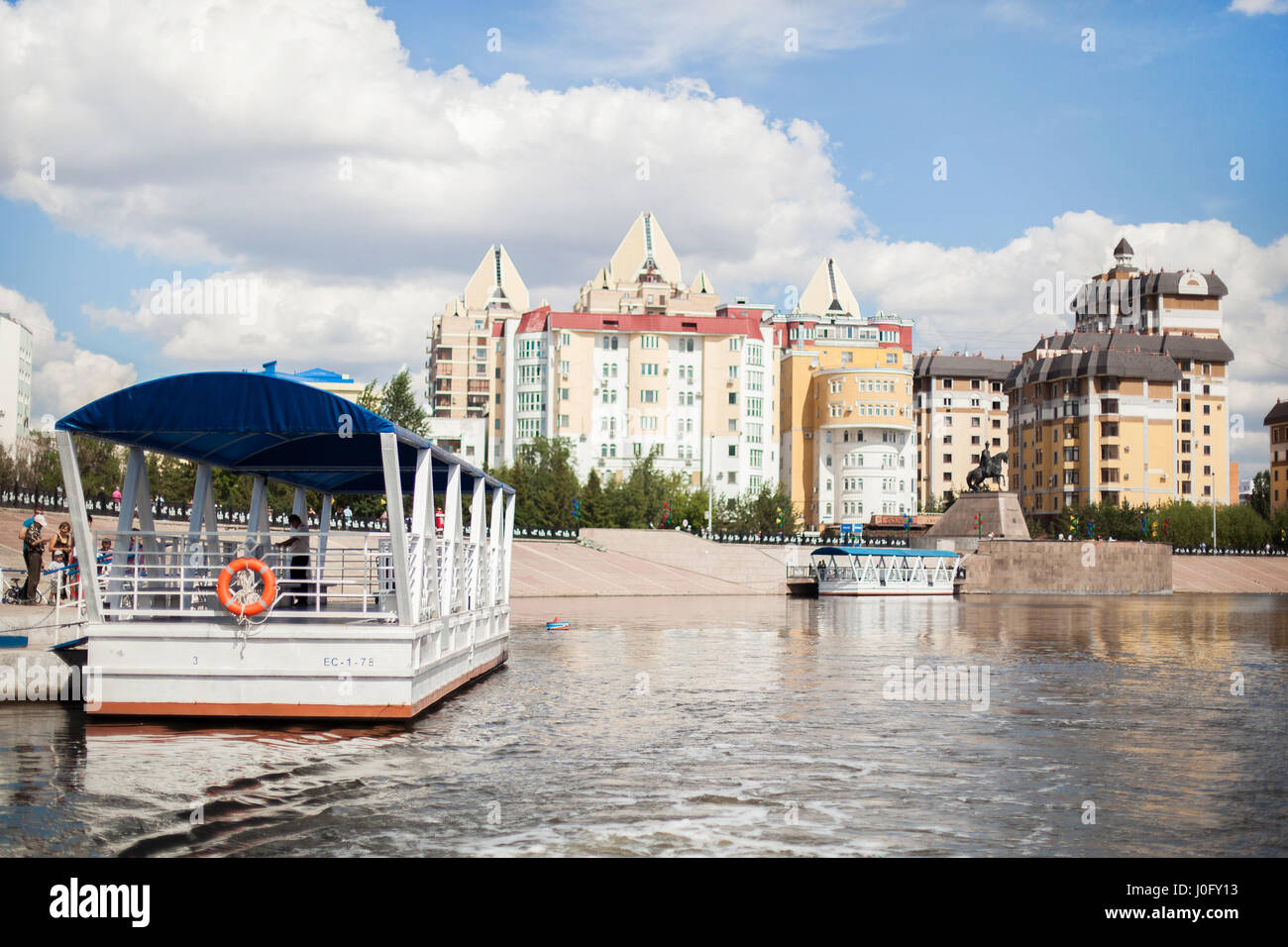 Boat on the river Ishim in Astana. Sunny weather in the capital of Kazakhstan. Stock Photo