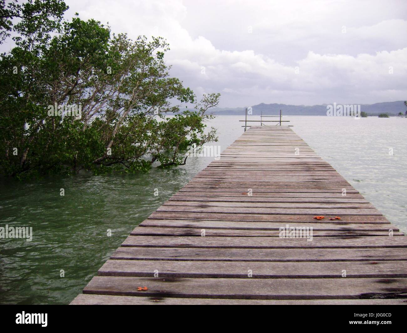 Wooden walkway on the beach, Philippines A wooden walkway in Kansilad, Lianga, Surigao del Sur Stock Photo