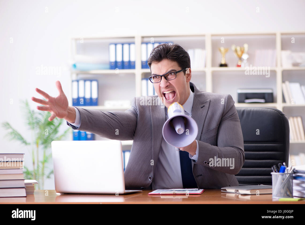Angry aggressive businessman in the office Stock Photo - Alamy