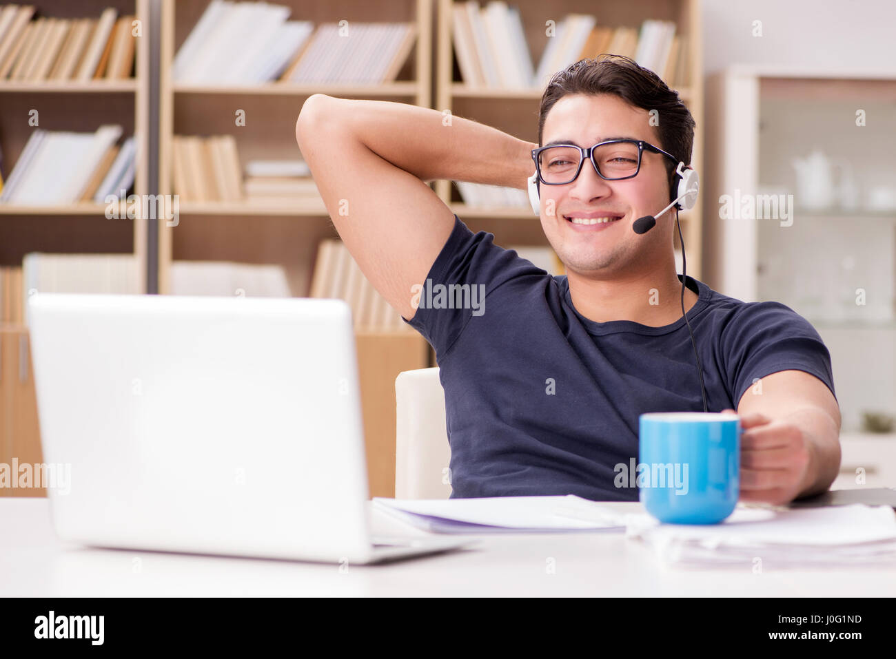 Young student drinking coffee from cup Stock Photo Alamy