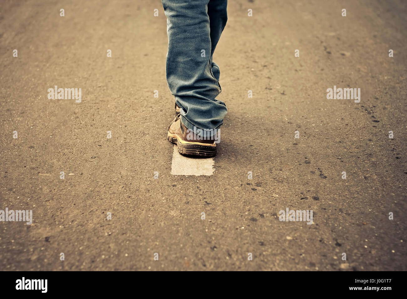 The road less travel. Human figure walking on the road and get two ...