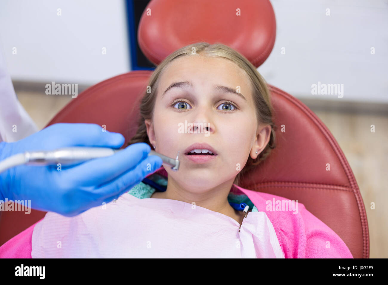 Young patient scared during a dental check-up at clinic Stock Photo