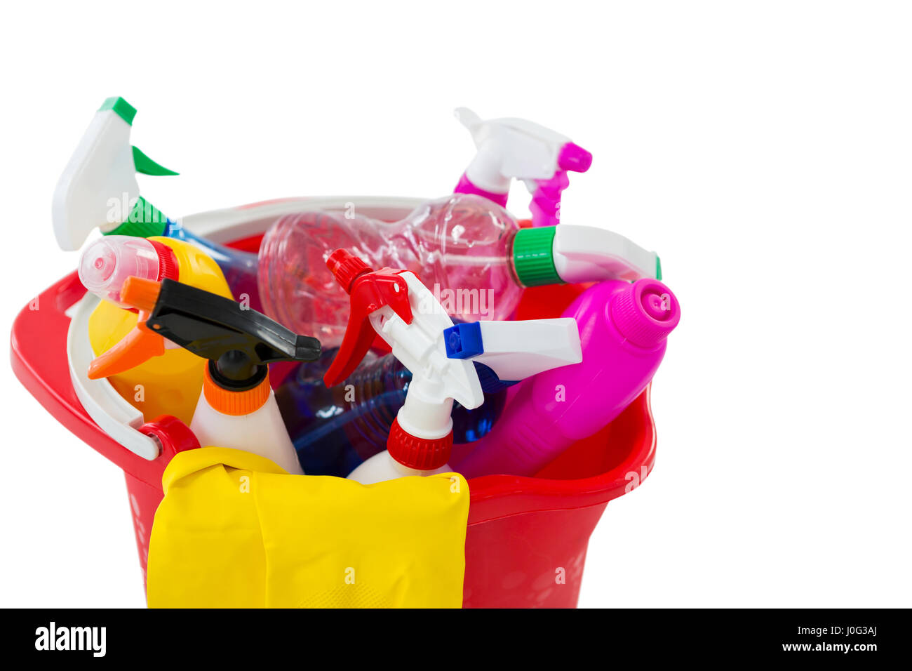 High angle view of cleaning spary and bottles in bucket against white background Stock Photo