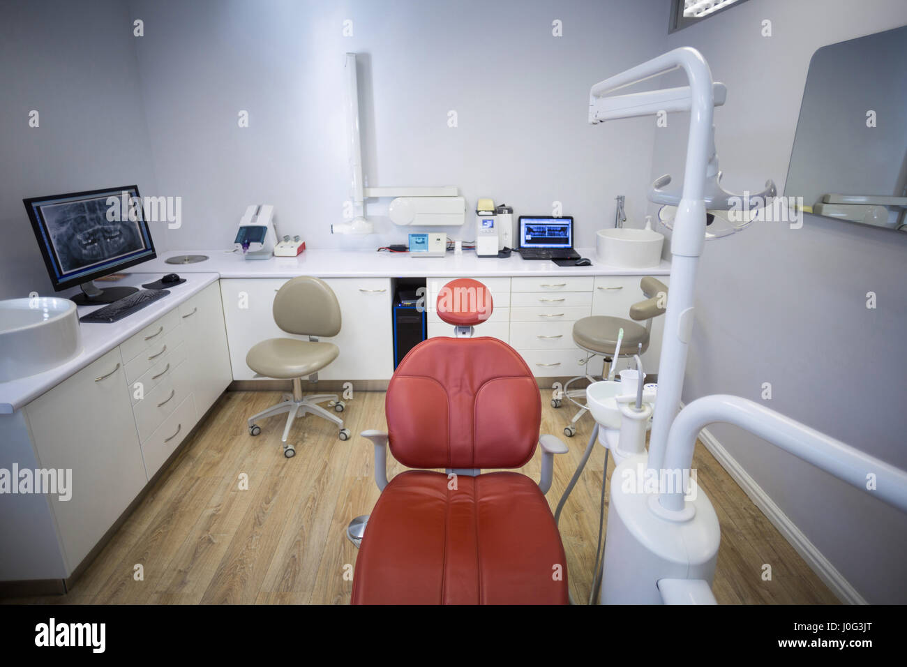 Professional dentistry chair and dentist tools in clinic Stock Photo